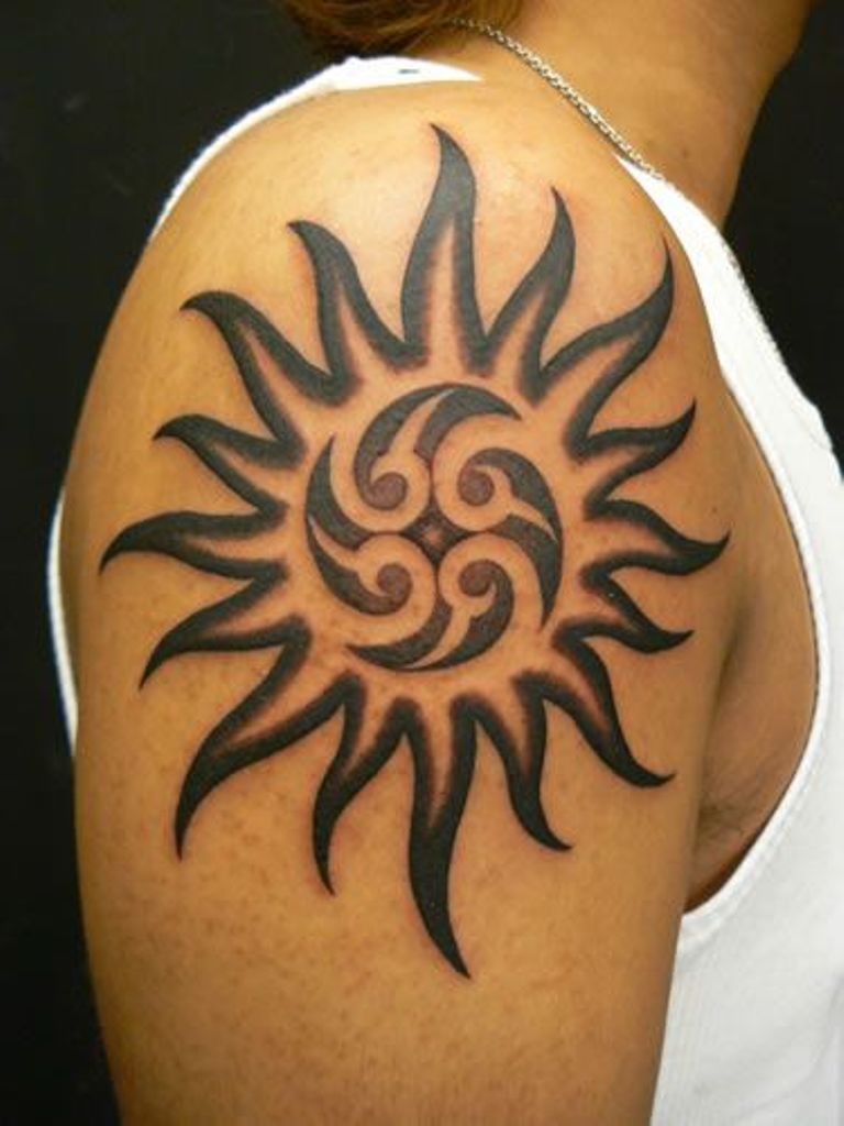 Black Tribal Sun Tattoo On Upper Arm