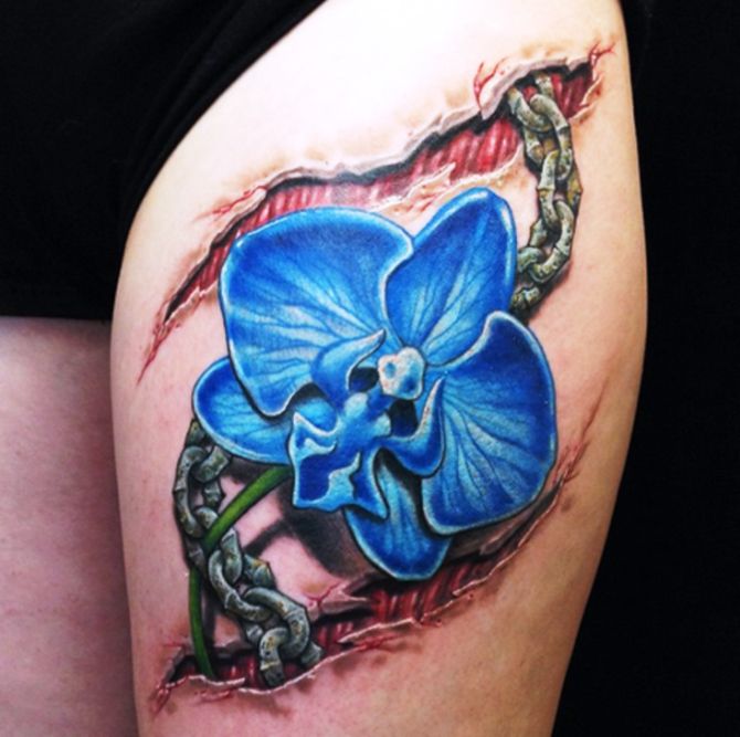Blue Orchid And Ripped Skin Chain tattoo On Thigh