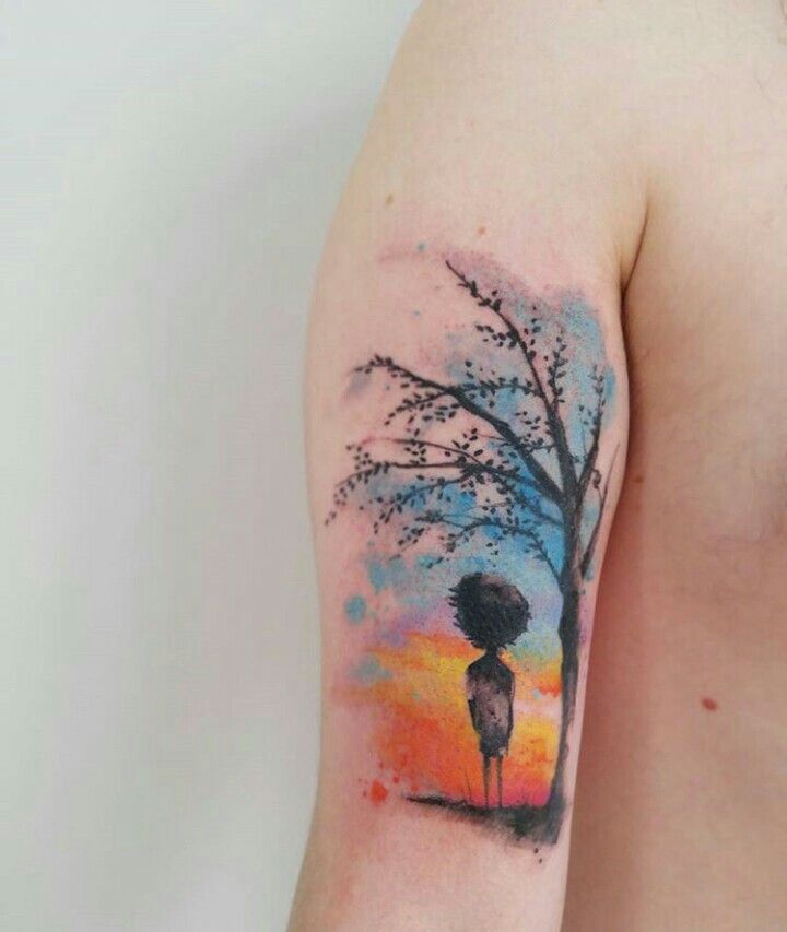 Boy Under Tree Watercolor Tattoo On Bicep