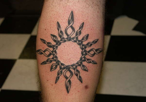 Celtic Sun Tattoo On Leg