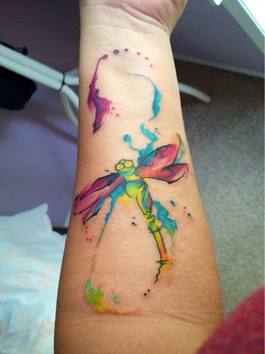 Colorful Dragonfly Tattoo On Forearm