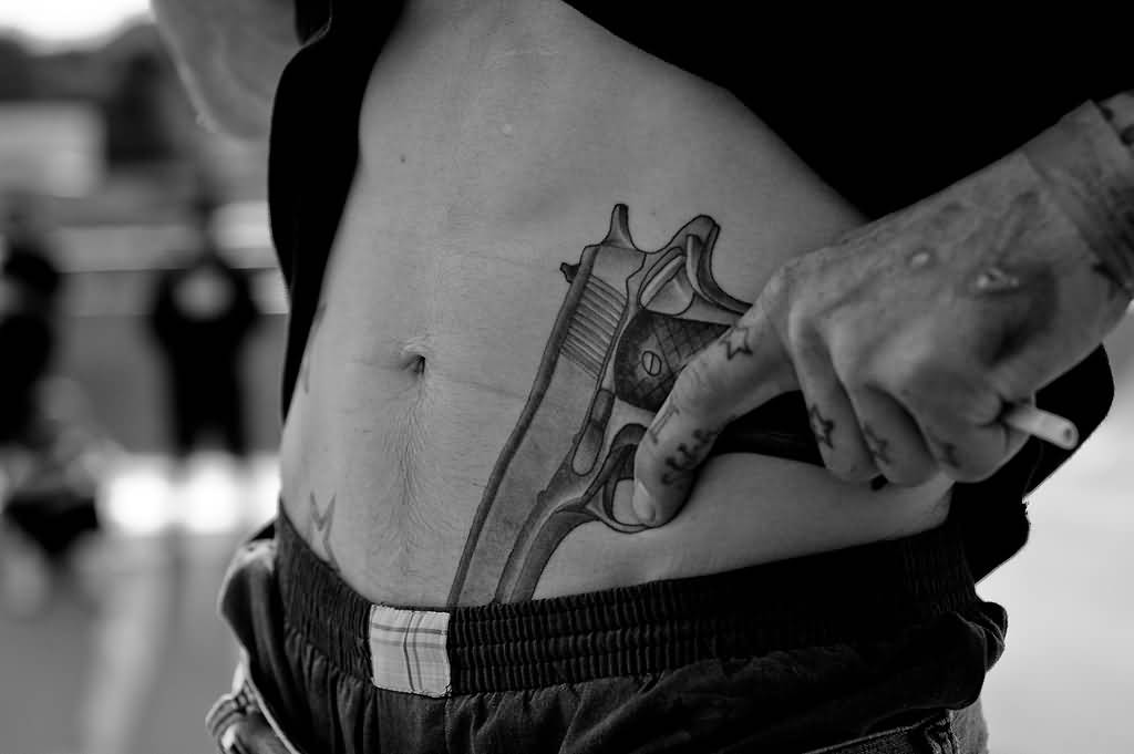 Cool Pistol Tattoo On Hip