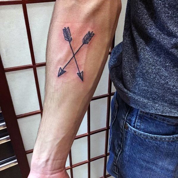 Crossed Arrow Tattoo On Inner Forearm
