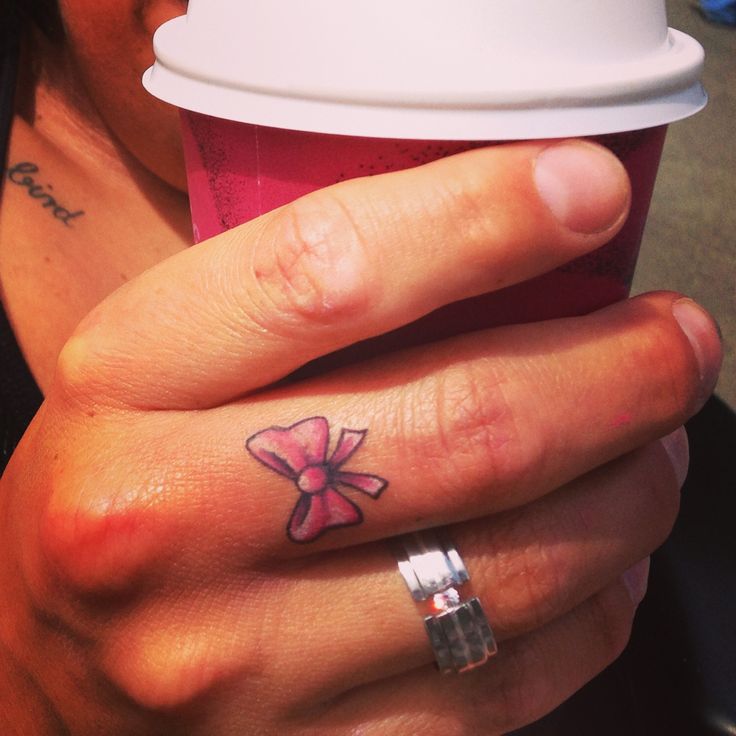 Cute Little Pink Bow Tattoo On Finger
