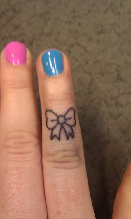 Cute Minimal Tiny Bow Tattoo On Finger