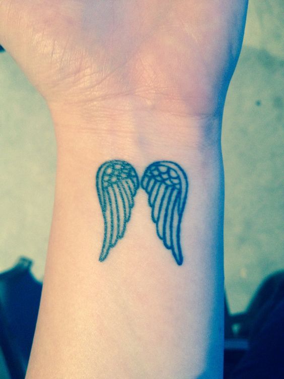 Cute Small Angel Wings Tattoo On Wrist