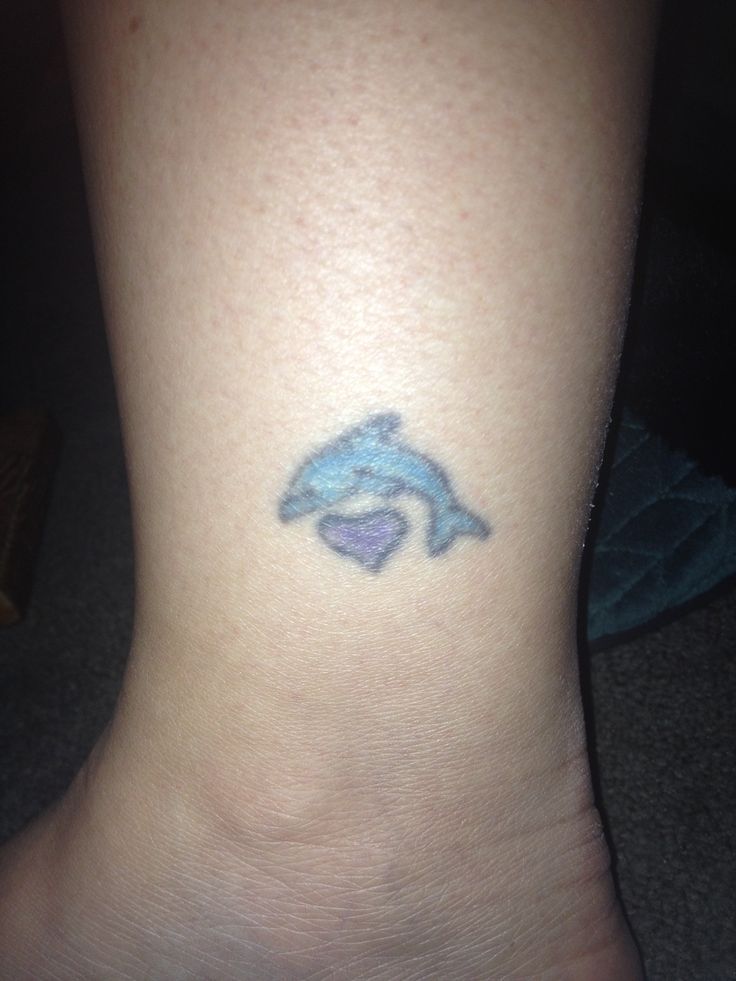 Cute Small Dolphin With Heart Tattoo On Leg