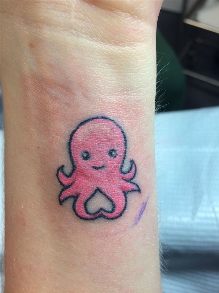 Cute Tiny Pink Octopus Tattoo On Wrist
