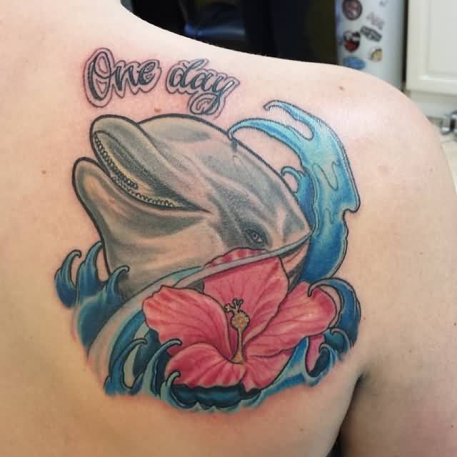 Dolphin With Flower And Water Wave Tattoo On Shoulder