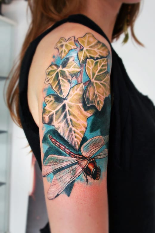 Dragonfly Sitting On leaves Tattoo On Half sleeve