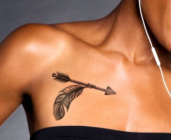 Feather Tied With Arrow Tattoo On Woman Front Shoulder