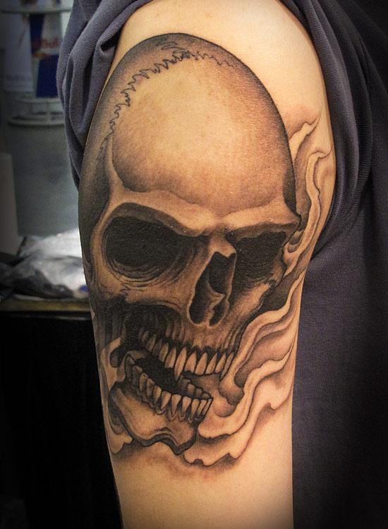 Flame And Skull Tattoo On Bicep