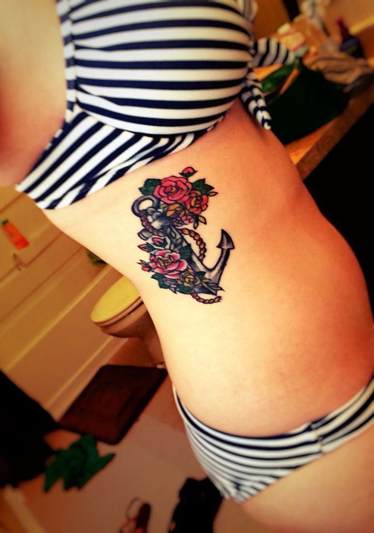 Flowers and Vintage Anchor Tattoo On Girl Side Rib