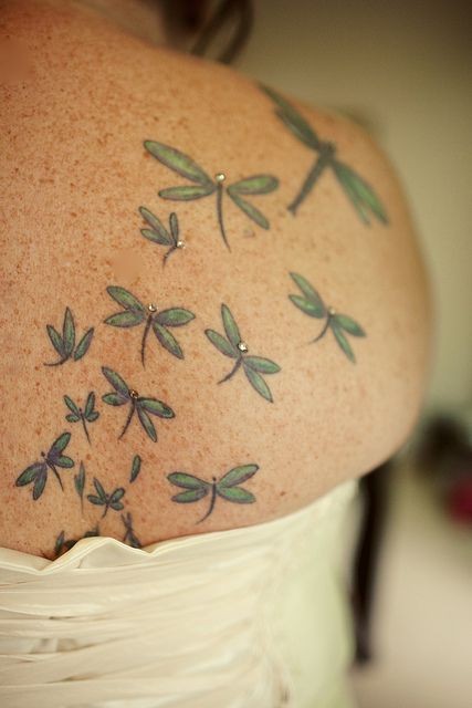 Flying Small Green Dragonflies Tattoo On Back