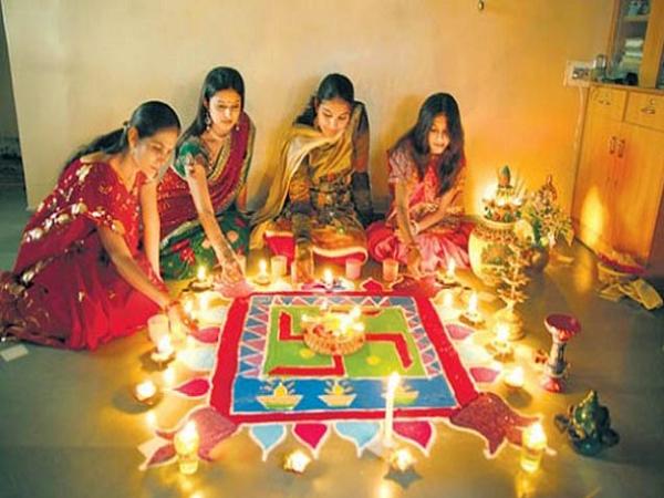 Girl Making Swastik Sign Rangoli Design For Diwali