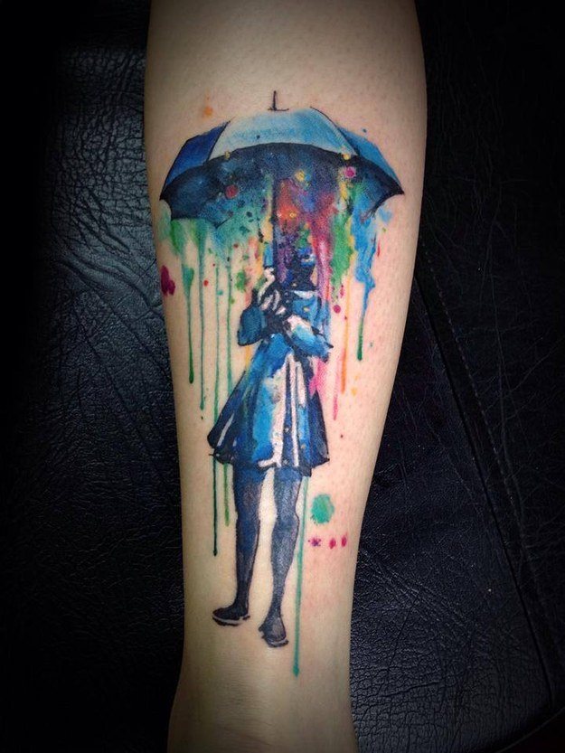 Girl Under Umbrella Watercolor Tattoo On Leg