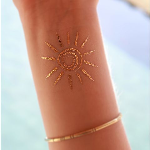Golden Henna Sun Tattoo On Wrist