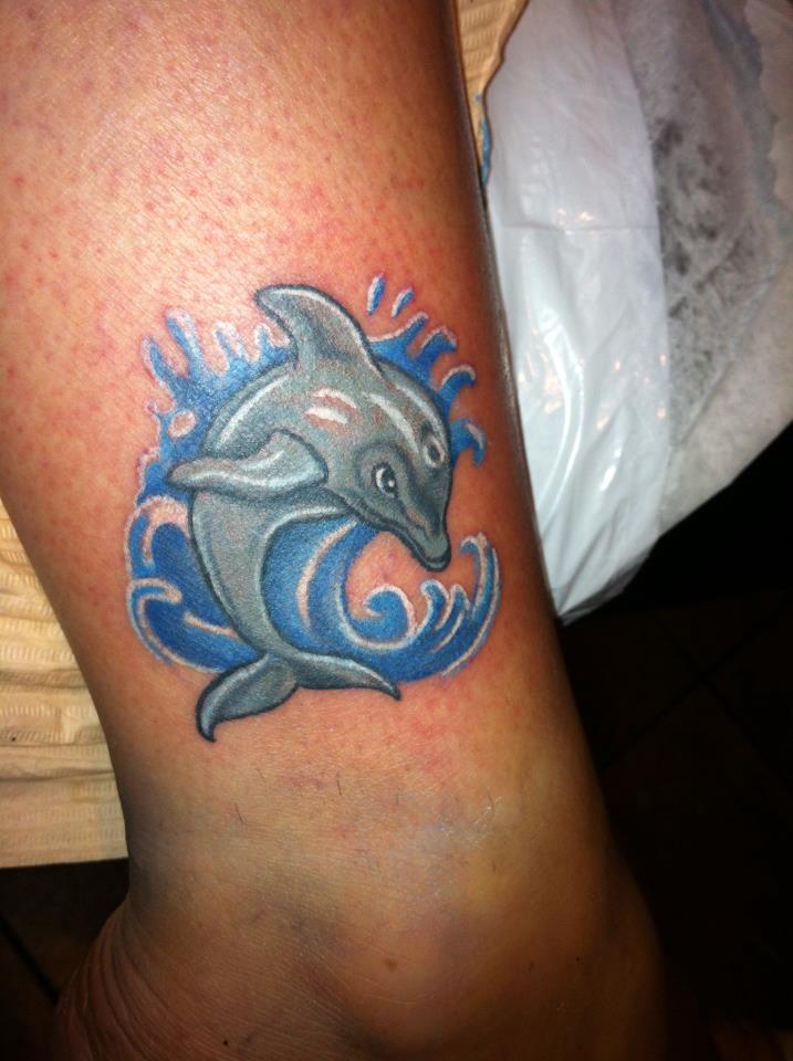 Gray Dolphin And Water Splash Tattoo On Leg