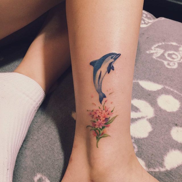 Gray Dolphin Tattoo With flower On Leg