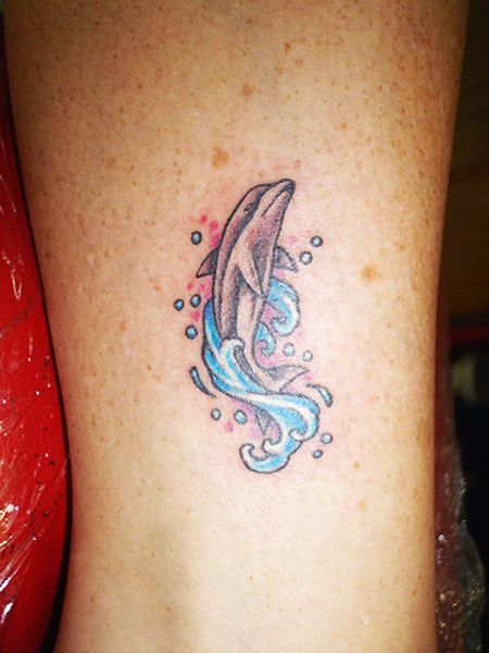 Gray Dolphin With water Splash Tattoo