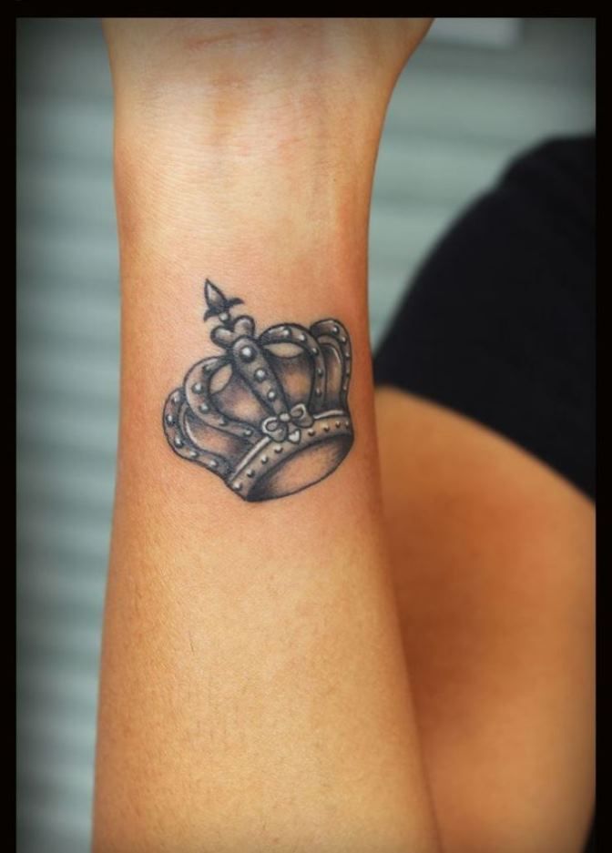 Gray Ink Crown Tattoo On Wrist