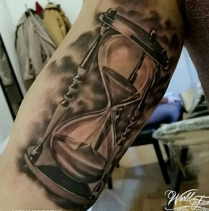 Grey Ink Realistic Hourglass Tattoo On Bicep