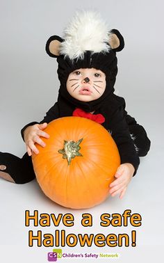 HAve a safe Halloween cute kid with big pumpkin picture