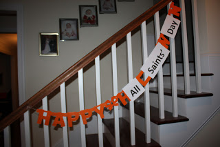 Happy All Saints Day decorated banner on stairs