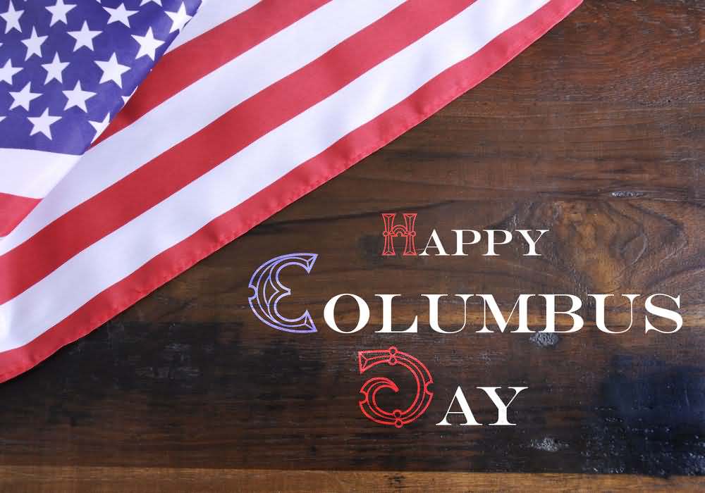 Happy Columbus Day Text Written On Wooden Table With American Flag