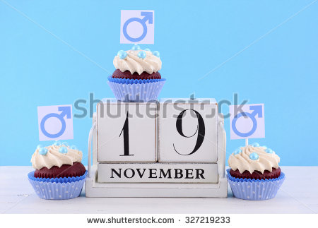 International Mens Day Cupcakes with Male Symbols with vintage wood calendar for November 19