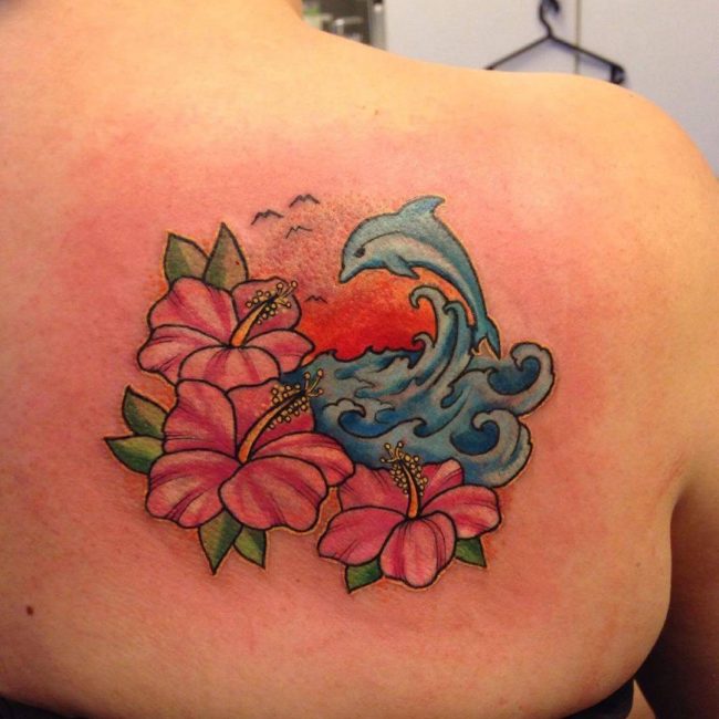 Jumping Dolohin With flowers Tattoo On Back shoulder