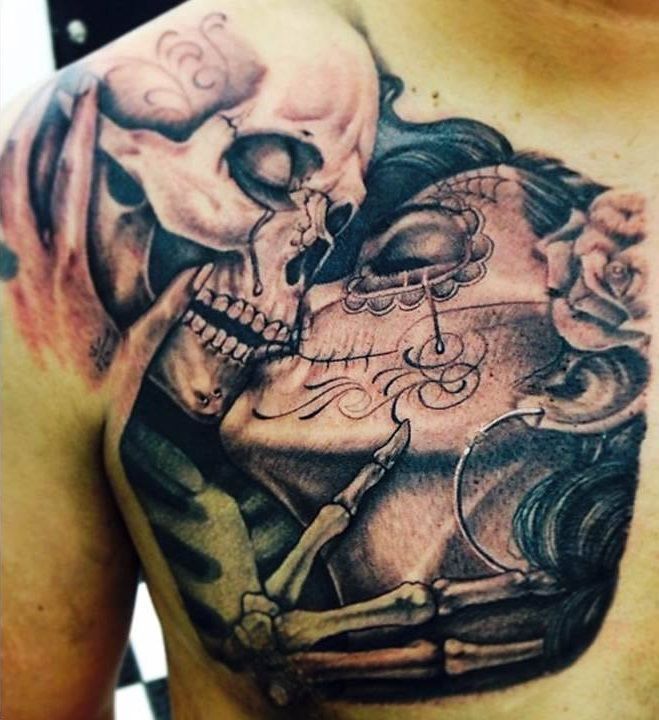 Kissing Skull Day Of The Dead Themed Tattoo On Chest
