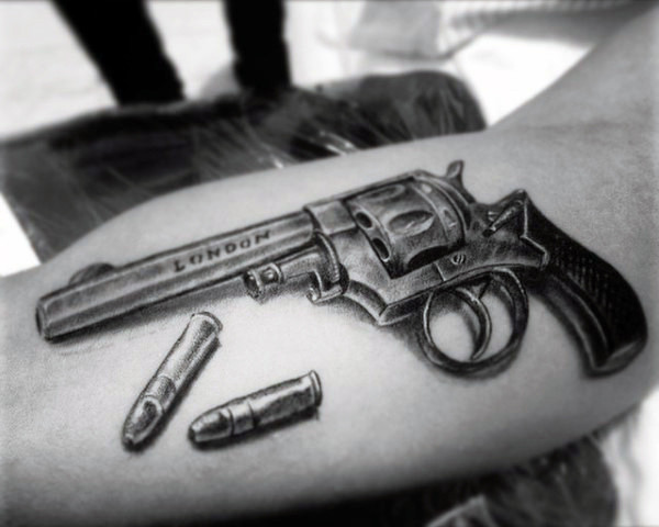 Metallic Pistol With Bullets Tattoo On Forearm