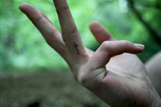 Minimal Cross Tattoo On Finger