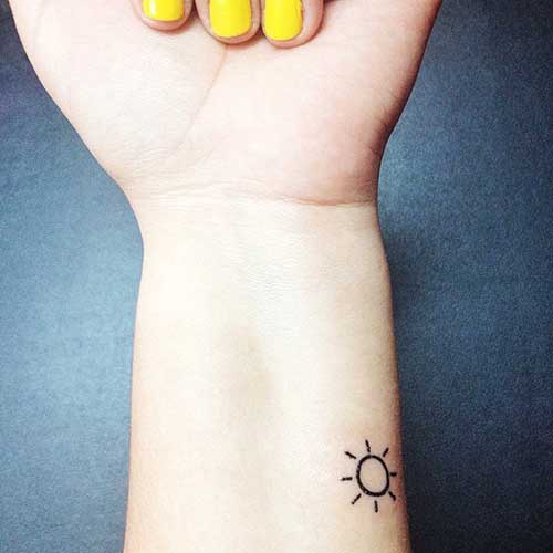 Minimal Small Sun Tattoo On Forearm