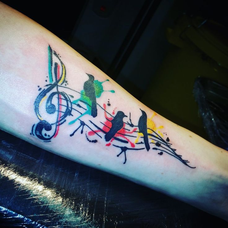 Musical Note With Paint Splatter Birds Tattoo On Arm