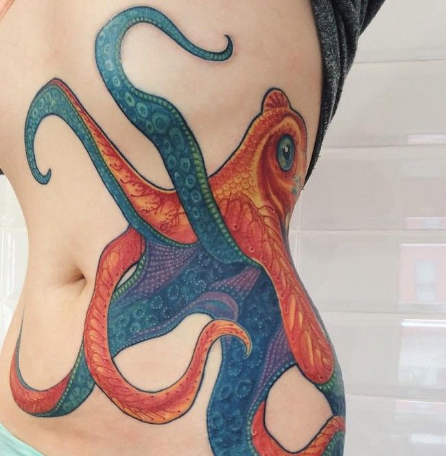 Orange And green Octopus Tattoo On Side Rib Cage