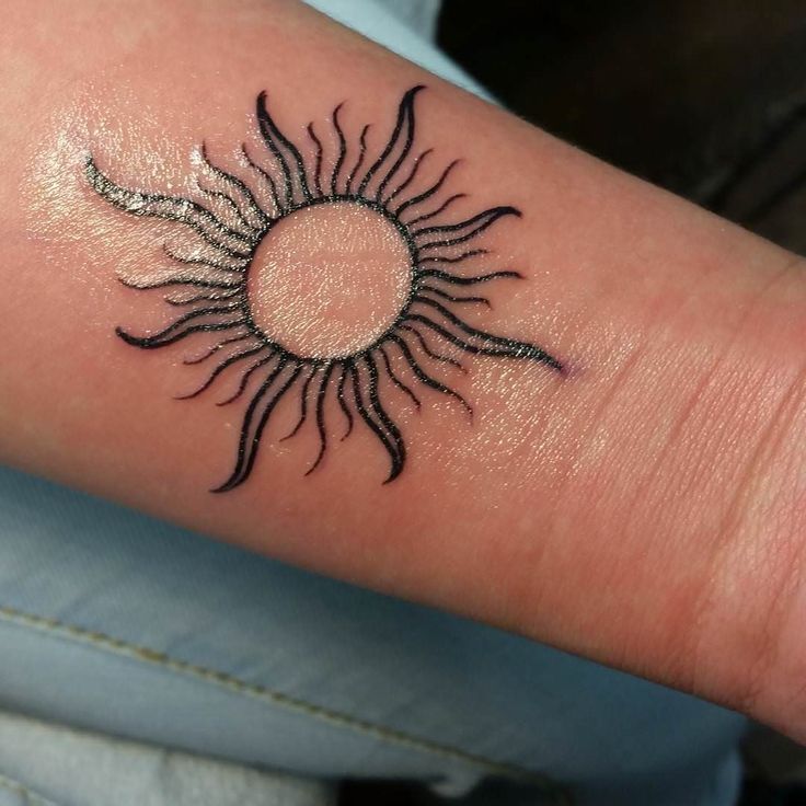 Outline Sun Tattoo on Wrist