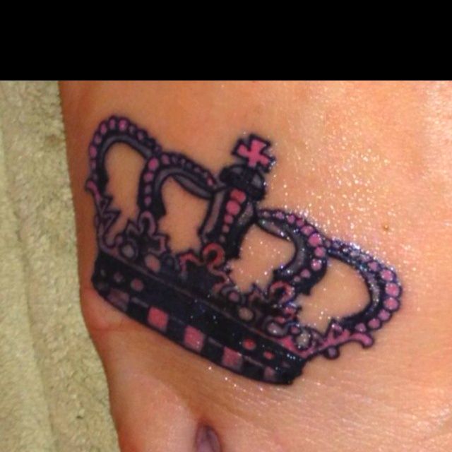 Pink And Black Crown Tattoo On Foot