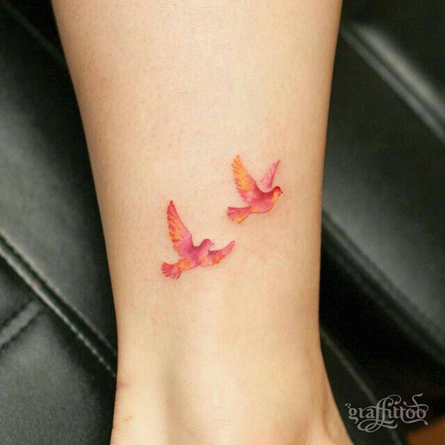 Pink And Orange Flying Birds Tattoo On Leg