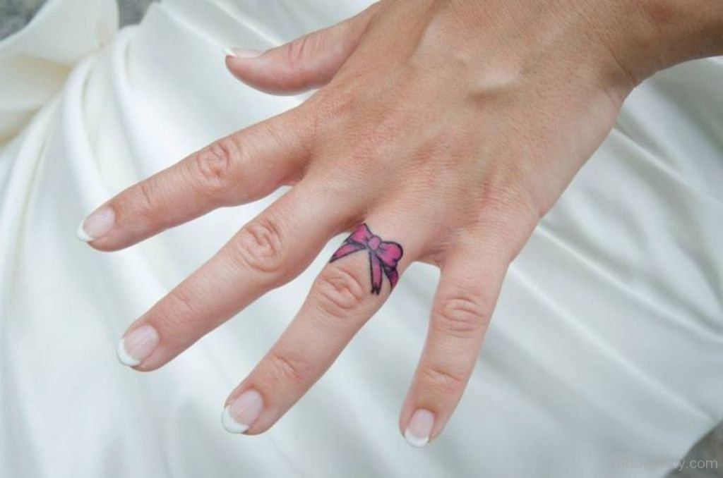 Pink Bow Tattoo On Finger