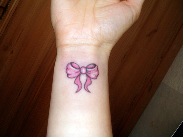 Pink Bow Tattoo On Wrist