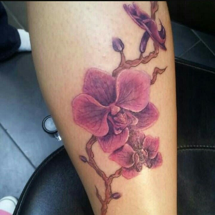 Pink Orchid Flower Branch Tattoo On Leg