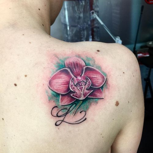 Pink Orchid Flower with Green Background And L Letter Tattoo