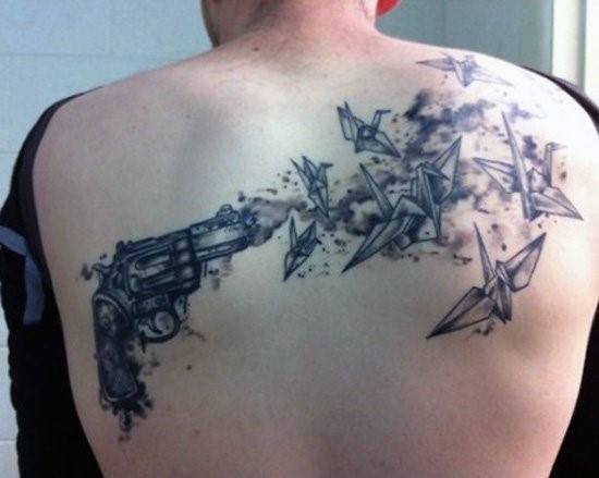Pistol Tattoo On Mans Back With Birds