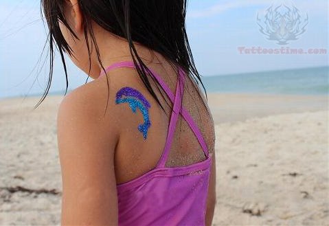 Purple And Blue Glitter Dolphin Tattoo On Back Shoulder