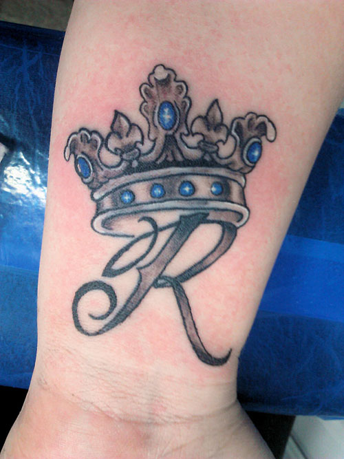 R With Crown Tattoo On Wrist