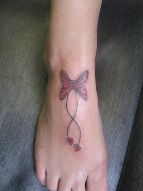 Red Bow With Hearts Tattoo On Foot