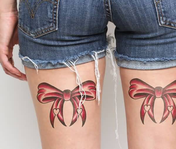 Red Bow With Hearts Tattoo On Thighs