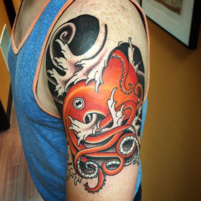Red Octopus Tattoo On Bicep